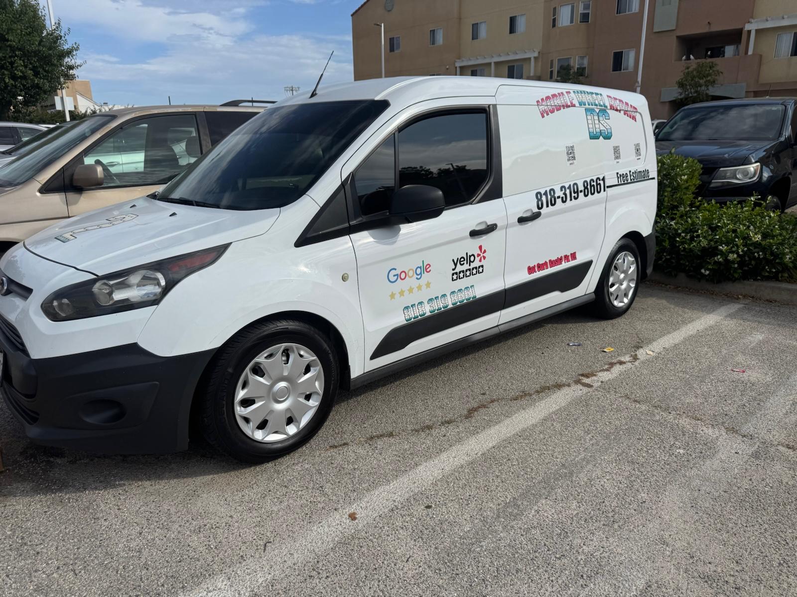 D S Mobile Wheel Repair branded Ford Transit van with phone number and five-star Google and Yelp badges